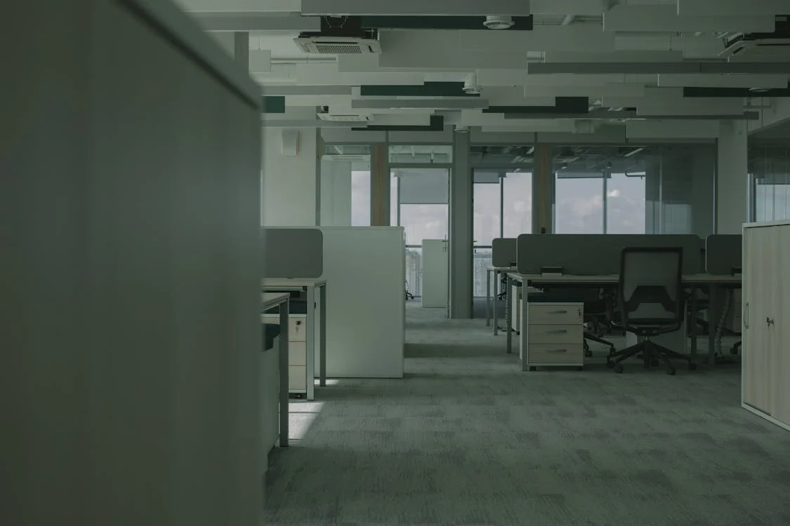 Large dark office room with carpet
